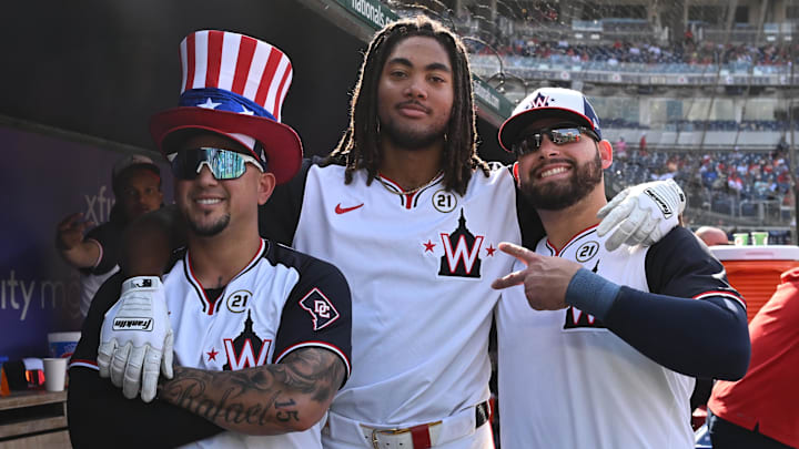 Sep 15, 2024; Washington, District of Columbia, USA; Washington Nationals left fielder James Wood (center) celebrates his second home run of the game by posing with second baseman Ildemaro Vargas (left) and first baseman Juan Yepez (right) by posing for a photo against the Miami Marlins during the eighth inning at Nationals Park.