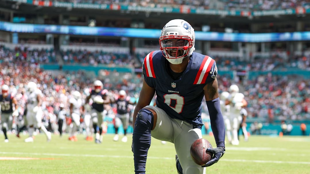 Sep 14, 2025; Miami Gardens, Florida, USA; New England Patriots wide receiver Kayshon Boutte (9) races after scoring a touchdown against the Miami Dolphins in the first quarter  at Hard Rock Stadium. Mandatory Credit: Nathan Ray Seebeck-Imagn Images