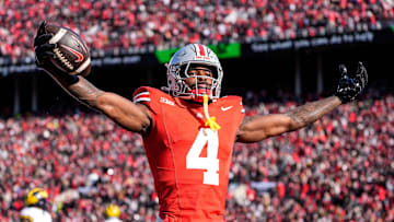 Ohio State wide receiver Jeremiah Smith (4) celebrates a touchdown against Michigan during the first half at Ohio Stadium in Columbus, Ohio on Saturday, Nov. 30, 2024.