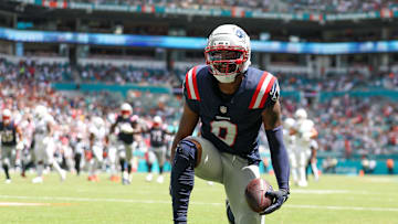 Sep 14, 2025; Miami Gardens, Florida, USA; New England Patriots wide receiver Kayshon Boutte (9) races after scoring a touchdown against the Miami Dolphins in the first quarter  at Hard Rock Stadium. Mandatory Credit: Nathan Ray Seebeck-Imagn Images