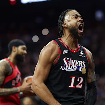 Nov 8, 2025; Philadelphia, Pennsylvania, USA; Philadelphia 76ers forward Trendon Watford (12) reacts after a score and foul against the Toronto Raptors during the first quarter at Xfinity Mobile Arena. Mandatory Credit: Bill Streicher-Imagn Images