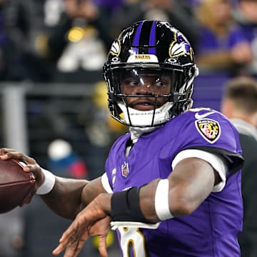 Jan 11, 2025; Baltimore, Maryland, USA; Baltimore Ravens quarterback Lamar Jackson (8) warms up before an AFC wild card game against the Pittsburgh Steelers at M&T Bank Stadium. Mandatory Credit: Mitch Stringer-Imagn Images