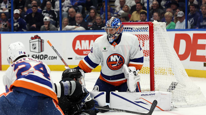 Dec 6, 2025; Tampa, Florida, USA; New York Islanders goaltender Ilya Sorokin (30) defends the puck against the Tampa Bay Lightning during the third period at Benchmark International Arena. Mandatory Credit: Kim Klement Neitzel-Imagn Images