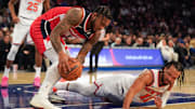Nov 3, 2025; New York, New York, USA; Washington forward Cam Whitmore (1) battles New York Knicks guard Jalen Brunson (11) for a ball during the second half at Madison Square Garden. Mandatory Credit: Lucas Boland-Imagn Images
