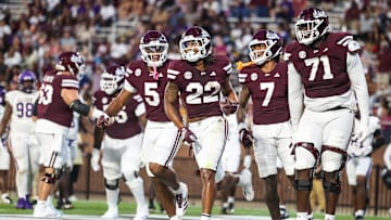 Sep 13, 2025; Starkville, Mississippi, USA; Mississippi State Bulldogs running back Xavier Gayten (22) celebrates with tight end Max Reese (5), wide receiver Markus Allen (7), and offensive lineman Saquon Miles (71) after a touchdown against the Alcorn State Braves during the second half at Davis Wade Stadium at Scott Field. Mandatory Credit: Wesley Hale-Imagn Images