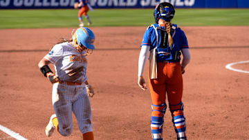 Tennessee's Gabby Leach (55) scores a run as Florida's Jocelyn Erickson (8) waits for the throw in the first inning of the Women's College World Series softball game between the Florida Gators and the Tennessee Volunteers at Devon Park in Oklahoma City, Friday, May, 30, 2025.