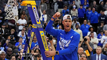 Mar 29, 2025; Newark, NJ, USA; Duke Blue Devils head coach Jon Scheyer cuts down the net after the Duke Blue Devils beat the Alabama Crimson Tide in the East Regional final.