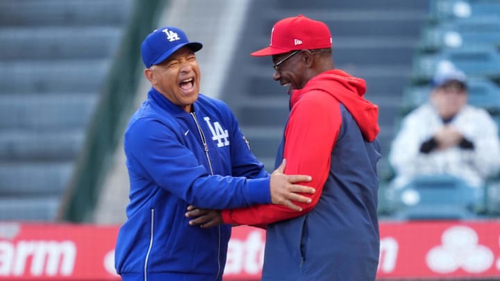 Dodgers manager Dave Roberts and Angels manager Ron Washington during the game at Angel Stadium on March 25.