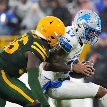 Green Bay Packers linebacker Edgerrin Cooper pursues Detroit Lions wide receiver Tim Patrick.