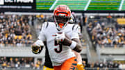 Bengals Tee Higgins (5) takes the ball down the field during their game against the Steelers on Sunday November 16, 2025 at Acrisure Stadium.