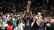 Jun 17, 2024; Boston, Massachusetts, USA; Boston Celtics guard Jaylen Brown (7) holds up the trophy after winning the 2024 NBA Finals against the Dallas Mavericks at TD Garden. Mandatory Credit: Peter Casey-Imagn Images