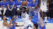 May 22, 2025; Oklahoma City, Oklahoma, USA; Minnesota Timberwolves forward Julius Randle (30) rebounds against Oklahoma City Thunder forward Jalen Williams (8), forward Chet Holmgren (7) and center Isaiah Hartenstein (55) in the second quarter during game two of the western conference finals for the 2025 NBA Playoffs at Paycom Center. Mandatory Credit: Alonzo Adams-Imagn Images