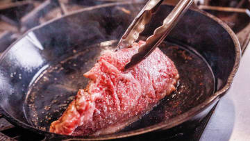 Palm Beach Meats executive chef Emerson Frisbie sears a Japanese A5 wagyu steak in a cast-iron