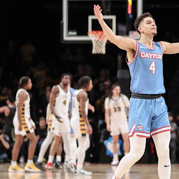 Mar 12, 2023; Brooklyn, NY, USA;  Dayton Flyers guard Koby Brea (4) waves to the crowd after a timeout is called by the Virginia Commonwealth Rams in the first half at Barclays Center. Mandatory Credit: Wendell Cruz-Imagn Images