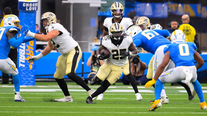 New Orleans Saints running back Kendre Miller (25) carries the ball against the Chargers