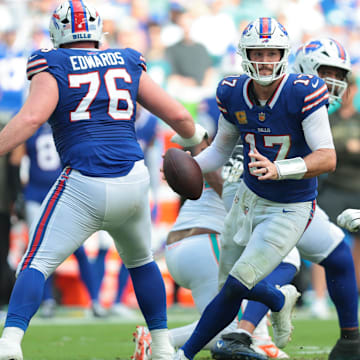 Nov 9, 2025; Miami Gardens, Florida, USA; Buffalo Bills quarterback Josh Allen (17) scrambles against Miami Dolphins defensive tackle Zach Sieler (92) during the second half at Hard Rock Stadium.