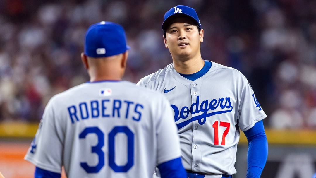 Sep 23, 2025; Phoenix, Arizona, USA; Los Angeles Dodgers pitcher/designated hitter Shohei Ohtani looks at manager Dave Roberts as he walks to the pitchers mound against the Arizona Diamondbacks at Chase Field. Mandatory Credit: Mark J. Rebilas-Imagn Images Sep 23, 2025; Phoenix, Arizona, USA; Los Angeles Dodgers pitcher/designated hitter Shohei Ohtani looks at manager Dave Roberts as he walks to the pitchers mound against the Arizona Diamondbacks at Chase Field. Mandatory Credit: Mark J. Rebilas-Imagn Images