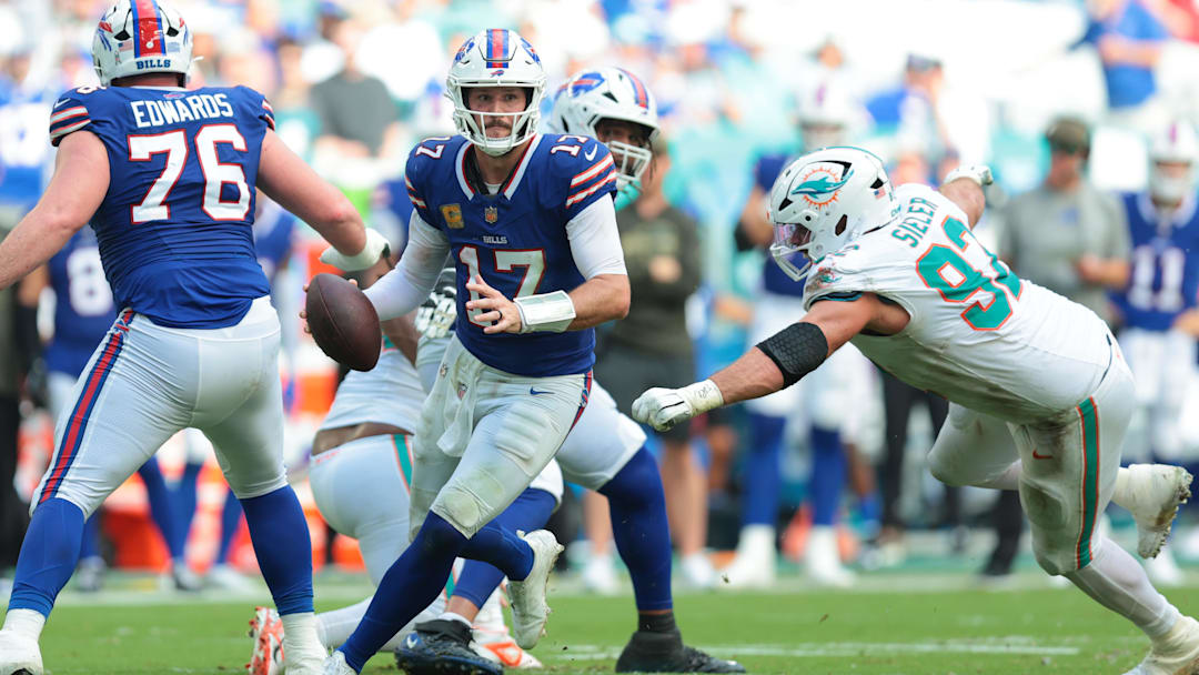Nov 9, 2025; Miami Gardens, Florida, USA; Buffalo Bills quarterback Josh Allen (17) scrambles against Miami Dolphins defensive tackle Zach Sieler (92)