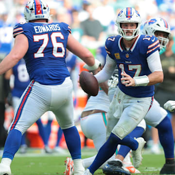 Nov 9, 2025; Miami Gardens, Florida, USA; Buffalo Bills quarterback Josh Allen (17) scrambles against Miami Dolphins defensive tackle Zach Sieler (92)