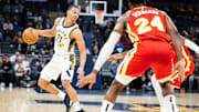 Oct 16, 2023; Indianapolis, Indiana, USA; Indiana Pacers guard Isaiah Wong (21) dribbles the ball in the second half against the Atlanta Hawks at Gainbridge Fieldhouse. Mandatory Credit: Trevor Ruszkowski-USA TODAY Sports
