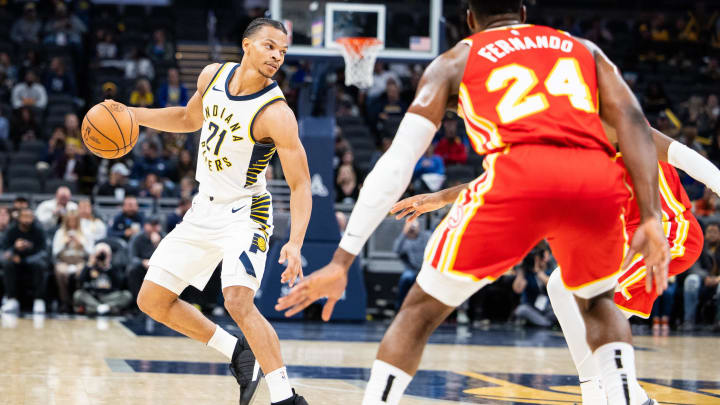 Oct 16, 2023; Indianapolis, Indiana, USA; Indiana Pacers guard Isaiah Wong (21) dribbles the ball in the second half against the Atlanta Hawks at Gainbridge Fieldhouse. Mandatory Credit: Trevor Ruszkowski-USA TODAY Sports