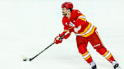 Apr 13, 2025; Calgary, Alberta, CAN; Calgary Flames defenseman Rasmus Andersson (4) skates with the puck against the San Jose Sharks during the first period at Scotiabank Saddledome. Mandatory Credit: Sergei Belski-Imagn Images