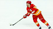 Apr 13, 2025; Calgary, Alberta, CAN; Calgary Flames defenseman Rasmus Andersson (4) skates with the puck against the San Jose Sharks during the first period at Scotiabank Saddledome. Mandatory Credit: Sergei Belski-Imagn Images