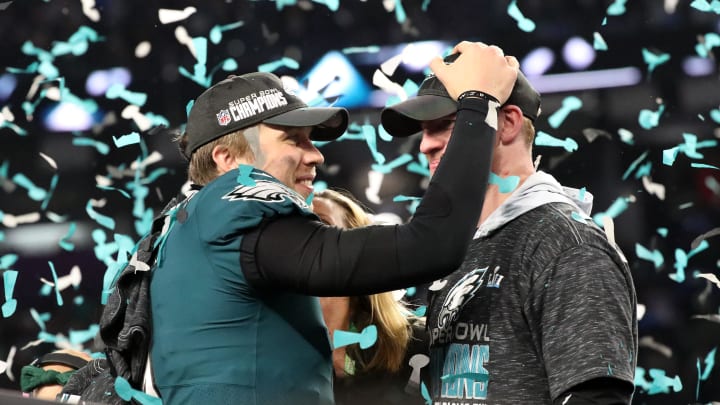 Feb 4, 2018; Minneapolis, MN, USA; Philadelphia Eagles quarterback Nick Foles (9) celebrates with Philadelphia Eagles quarterback Carson Wentz (R) after defeating the New England Patriots to win Super Bowl LII at U.S. Bank Stadium. Kirt Dozier-USA TODAY Sports