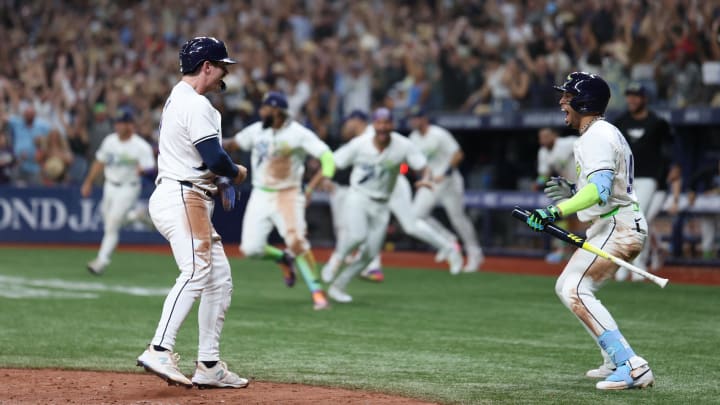 Aug 16, 2024; St. Petersburg, Florida, USA; Tampa Bay Rays outfielder Jonny DeLuca (21) scores a run against the Arizona Diamondbacks in the ninth inning at Tropicana Field. Mandatory Credit: Nathan Ray Seebeck-USA TODAY Sports