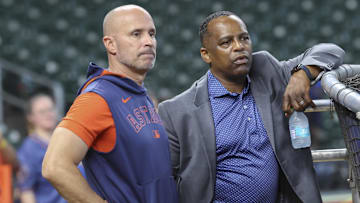 Jun 28, 2025; Houston, Texas, USA; Houston Astros manager Joe Espada (left) and general manager Dana Brown (right) talk on the field before the game against the Chicago Cubs at Daikin Park. Mandatory Credit: Troy Taormina-Imagn Images