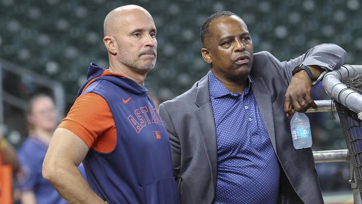 Jun 28, 2025; Houston, Texas, USA; Houston Astros manager Joe Espada (left) and general manager Dana Brown (right) talk on the field before the game against the Chicago Cubs at Daikin Park. Mandatory Credit: Troy Taormina-Imagn Images