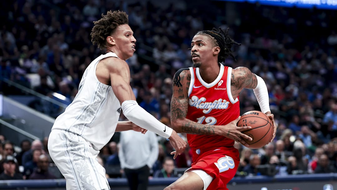 Mar 7, 2025; Dallas, Texas, USA; Memphis Grizzlies guard Ja Morant (12) drives to the basket as Dallas Mavericks forward Kessler Edwards (20) defends during the first half at American Airlines Center. Mandatory Credit: Kevin Jairaj-Imagn Images