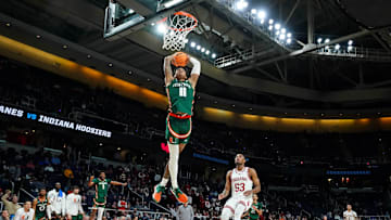 Mar 19, 2023; Albany, NY, USA; Miami (Fl) Hurricanes guard Jordan Miller (11) dunks against the Indiana Hoosiers during the second half at MVP Arena. Mandatory Credit: David Butler II-Imagn Images