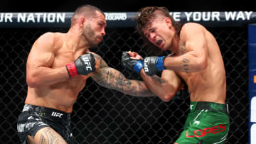 Jun 29, 2024; Las Vegas, Nevada, USA; Dan Ige (red gloves) fights Diego Lopes (blue gloves) during UFC 303 at T-Mobile Arena. Mandatory Credit: Mark J. Rebilas-USA TODAY Sports