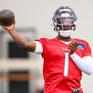 May 10, 2025; Nashville, TN, USA;  Tennessee Titans quarterback Cam Ward (1) throws during drills during Rookie Mini Camp at Saint Thomas Sports Park. Mandatory Credit: Steve Roberts-Imagn Images