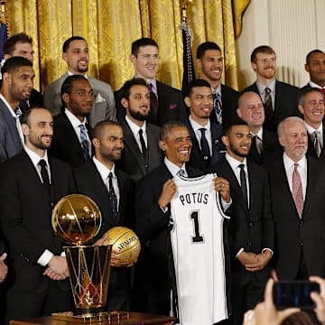 Jan 12, 2015; Washington, DC, USA; President Barack Obama (middle) poses with the San Antonio Spurs during a ceremony honoring the NBA Champion Spurs in the East Room at The White House. 