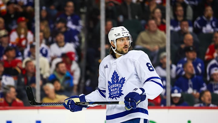 Feb 4, 2025; Calgary, Alberta, CAN; Toronto Maple Leafs defenseman Chris Tanev (8) against the Calgary Flames during the second period at Scotiabank Saddledome. Mandatory Credit: Sergei Belski-Imagn Images