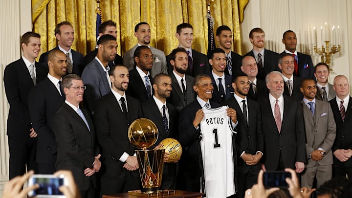 Jan 12, 2015; Washington, DC, USA; President Barack Obama (middle) poses with the San Antonio Spurs during a ceremony honoring the NBA Champion Spurs in the East Room at The White House. 