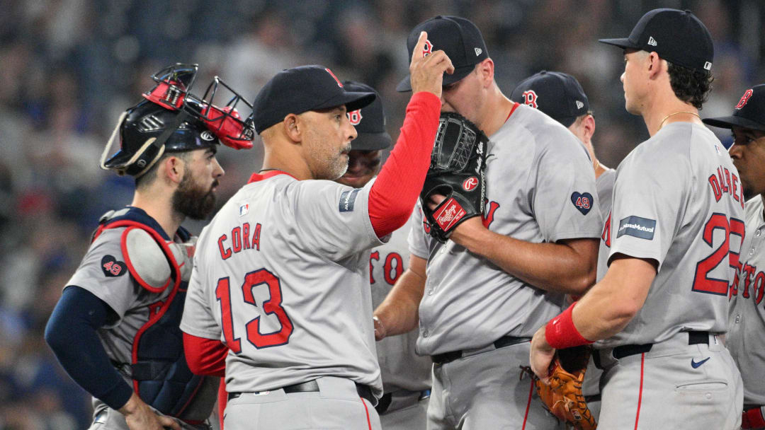 Jun 17, 2024; Toronto, Ontario, CAN;  Boston Red Sox manager Alex Cora (13) gestures to the bullpen as he relieves pitcher Brad Keller (46) in the ninth inning against the Toronto Blue Jays at Rogers Centre. Mandatory Credit: Dan Hamilton-USA TODAY Sports