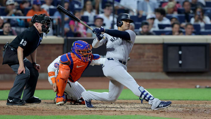 Jun 25, 2024; New York City, New York, USA; New York Yankees right fielder Juan Soto (22) follows through on a solo home run against the New York Mets during the fifth inning at Citi Field. Mandatory Credit: Brad Penner-USA TODAY Sports