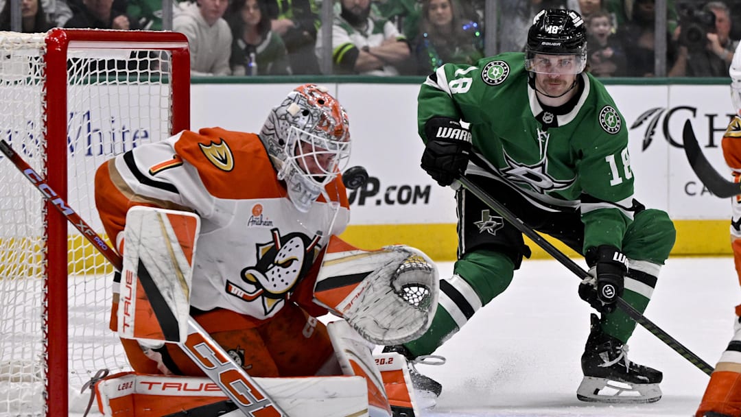 Mar 18, 2025; Dallas, Texas, USA; Anaheim Ducks goaltender Lukas Dostal (1) stops a shot as Dallas Stars center Sam Steel (18) looks for the rebound during the second period at the American Airlines Center. Mandatory Credit: Jerome Miron-Imagn Images Mar 18, 2025; Dallas, Texas, USA; Anaheim Ducks goaltender Lukas Dostal (1) stops a shot as Dallas Stars center Sam Steel (18) looks for the rebound during the second period at the American Airlines Center. Mandatory Credit: Jerome Miron-Imagn Images