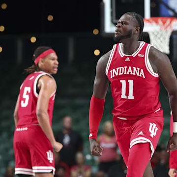 Indiana Hoosiers center Oumar Ballo (11) reacts after dunking against the Louisville Cardinals during the first half at the Atlantis Resort.