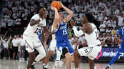 Feb 27, 2024; Starkville, Mississippi, USA; Kentucky Wildcats guard Reed Sheppard (15) scores on the final shot of the game as Mississippi State Bulldogs forward KeShawn Murphy (12) and guard Josh Hubbard (13) defend during the second half at Humphrey Coliseum. Mandatory Credit: Petre Thomas-USA TODAY Sports