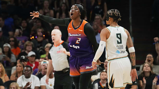 A photo of Kahleah Copper celebrating a thre