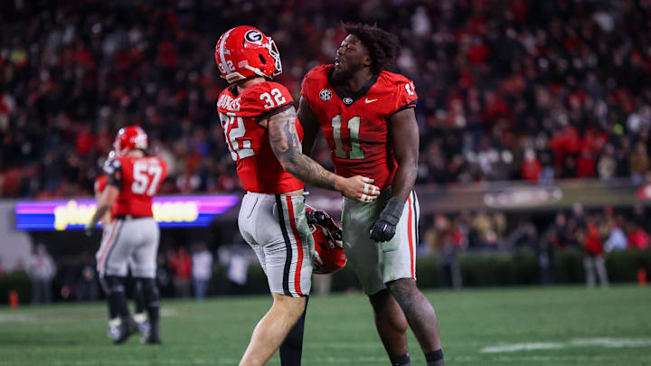 Nov 29, 2024; Athens, Georgia, USA; Georgia Bulldogs linebacker Chaz Chambliss (32) celebrates after a fumble recovery with linebacker Jalon Walker (11) against the Georgia Tech Yellow Jackets in the fourth quarter at Sanford Stadium. Mandatory Credit: Brett Davis-Imagn Images