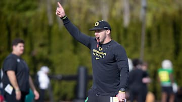 Oregon tight ends coach Drew Mehringer works with players during practice with the Ducks Thursday, April 11, 2024, at the Hatfield-Dowlin Complex in Eugene, Ore.