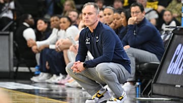 Mar 23, 2024; Iowa City, IA, USA; West Virginia Mountaineers head coach Mark Kellogg looks on during the first quarter against the Princeton Tigers of the NCAA first round game at Carver-Hawkeye Arena. Mandatory Credit: Jeffrey Becker-Imagn Images