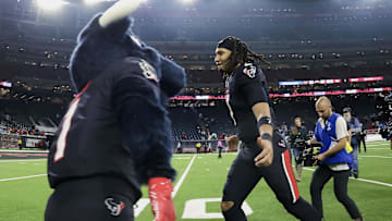 Jan 11, 2025; Houston, Texas, USA; Houston Texans quarterback C.J. Stroud (7) jogs off the field after the game against the Los Angeles Chargers in an AFC wild card game at NRG Stadium. Mandatory Credit: Troy Taormina-Imagn Images