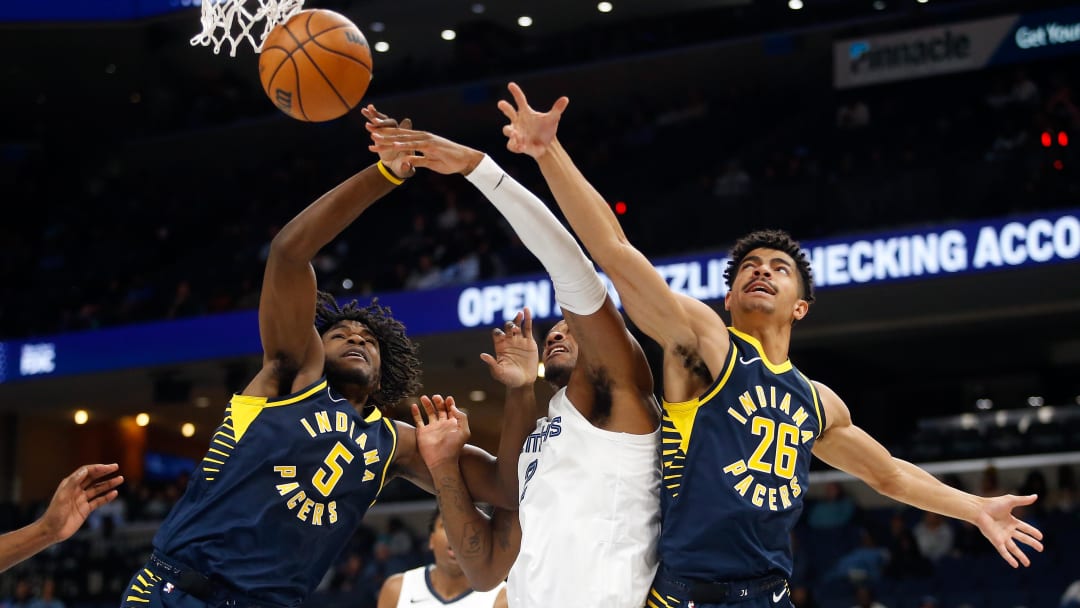 Oct 8, 2023; Memphis, Tennessee, USA; Indiana Pacers forward Jarace Walker (5), Memphis Grizzlies forward Xavier Tillman (2) and Indiana Pacers guard Ben Sheppard (26) battle for a rebound during the second half at FedExForum. Mandatory Credit: Petre Thomas-USA TODAY Sports