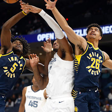 Oct 8, 2023; Memphis, Tennessee, USA; Indiana Pacers forward Jarace Walker (5), Memphis Grizzlies forward Xavier Tillman (2) and Indiana Pacers guard Ben Sheppard (26) battle for a rebound during the second half at FedExForum. Mandatory Credit: Petre Thomas-Imagn Images